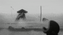 a black and white drawing of a man in a hat standing on a rock in the fog .