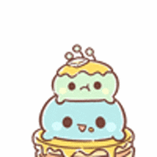 a cartoon character is sitting on top of a cake with a crown on top .