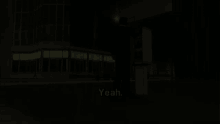 a man in a black suit is standing in the dark with the words yeah written on the bottom