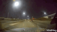 a video of a car driving down a highway with rexing dash cam at the bottom