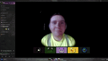 a computer screen shows a person 's face and a few icons on the bottom