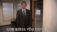 a man in a suit and tie is standing in front of a door and says `` god bless you sister '' .