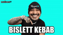 a man wearing a black beanie and a black shirt with the words bislett kebab on it