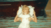 a woman holding a life preserver in the water
