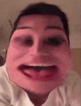 a close up of a person 's face with their tongue out