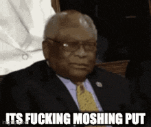 a man in a suit and tie says it 's fucking moshing put .