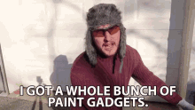 I Got A Whole Bunch Of Paint Gadgets Trapper Hat GIF - I Got A Whole Bunch Of Paint Gadgets Trapper Hat Box GIFs