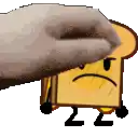 a hand is holding a piece of toast with a sad face and the number 22 on it .