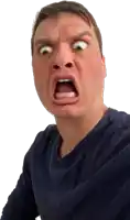 a man in a blue shirt making a funny face