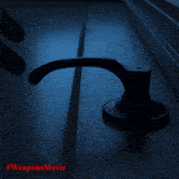 a person 's hand is reaching for a door handle in the dark