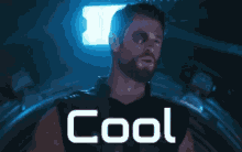 a man with a bandage on his eye is smiling and the word cool is above him