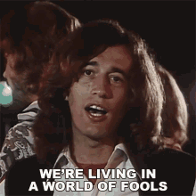 Were Living In A World Of Fools Robin Gibb GIF - Were Living In A World Of Fools Robin Gibb Bee Gees GIFs