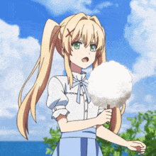 a girl with blonde hair is holding cotton candy