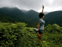 yoga girl standing bow pulling pose mexico hiking