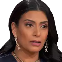 a woman wearing a necklace and earrings that say dior