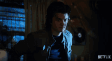 a netflix advertisement shows a man in a jacket asking what do you mean