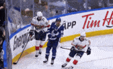 a hockey game is being played in front of an energy drink advertisement
