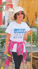 a woman wearing a white jac jean new york shirt