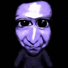 a close up of a purple face with black eyes and a beard .