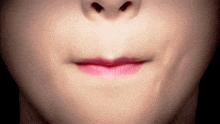 a close up of a person 's mouth with pink lips