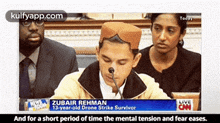 a young man is sitting in front of a microphone on a cnn news room
