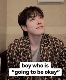 a man in a plaid jacket with the words boy who is going to be okay