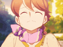 a girl with a purple and white scarf around her neck is sweating