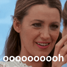 a close up of a woman 's face with the word oooooooh on the bottom right