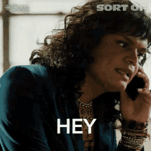a woman is talking on a cell phone and the word hey is on the screen