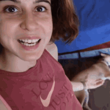 a woman wearing a shirt that says love just one