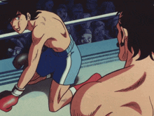 a man in a boxing ring with a crowd watching