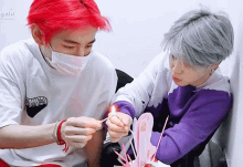 a man with red hair is wearing a mask