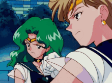 a couple of anime characters standing next to each other and one has a star on her chest