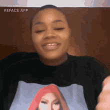 a woman wearing a black shirt with a picture of nicki minaj
