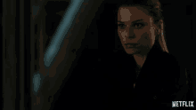 a netflix ad shows a woman in a dark room asking what are you