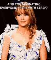 a woman in a blue and white dress is standing in front of a sign that says `` and contaminating everyone there with strip ? ''