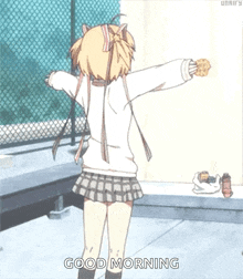 a girl with her arms outstretched is holding a cookie and says " good morning "