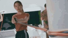a woman is holding a resistance band in her hands