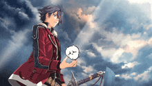 a boy in a red jacket holds a small white animal in his hands