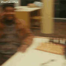 a blurry picture of a man taking a picture of himself in a mirror