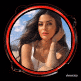 a woman in a white tank top is surrounded by a red circle with the words vivavideo on the bottom