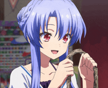 a girl with blue hair and red eyes holds a snake in her hands