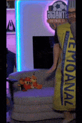 a man is holding a yellow towel that says lemonal