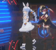 a couple of anime characters are dancing together on a stage