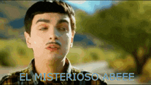 a man with a mustache and the words el misterioso abeee above him