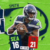 a seahawks football player named smith is holding a football