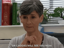 Dr Gaddas Smiling While Looking Down In Coronation Street Corrie GIF - Dr Gaddas Smiling While Looking Down In Coronation Street Corrie Coronation Street GIFs