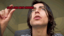 a man with long hair and a striped shirt says coca cola with cherries