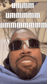 a man with a beard wears sunglasses and says ummm ummmmm ummmmm
