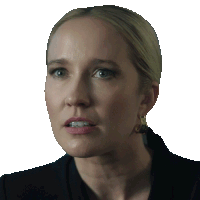 a close up of a woman 's face with a serious look on her face